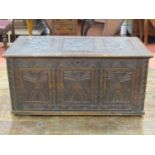 A 19th century oak coffer with repeating geometric carved detail, 120 wide, 65cm deep