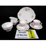 A collection of Duchess china tea wares with pink rose decoration comprising a pair of cake