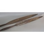 Two African hunting spears with metal tips and bamboo shafts, 2 metres long approximately