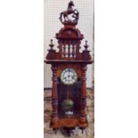 Vienna style wall clock with turned column supports and eight day movement