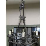 A good quality antique style cast metal hanging ceiling light in the gothic style with pierced