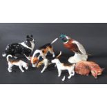 A collection of Beswick wares including a pheasant in flight number 850, a black and white collie, a
