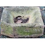 A carved and weathered natural stone drain/shallow trough of square form, (AF), 50 cm square x 16 cm