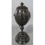 A 19th century bronze urn with cover with stag beetles to the sides, raised on a marble base, signed