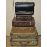 A quantity of vintage luggage to include canvas leather and fibre cases of varying design