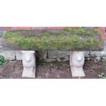A three sectional garden bench, the heavy weathered rectangular thick natural stone slab seat raised