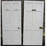 A pair of reclaimed 19th century painted pine internal moulded panelled doors with later fittings,
