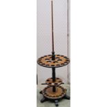 A contemporary snooker cue stand on three tiers with central turned stem, together with a walnut