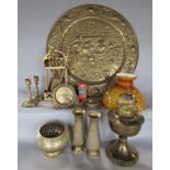 A brass wall plaque 63 cm diameter depicting a tavern scene and an assortment of other brassware,