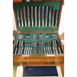 An oak canteen of cutlery made by Goldsmiths & Silversmiths Company Ltd London, complete set for