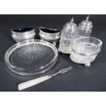 A silver condiments set, London 1886, two silver salts, a silver rimmed coaster and a small fork (5)