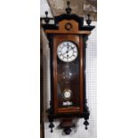 A small 19th century Vienna style regulator wall clock in walnut and with applied ebonised mounts,