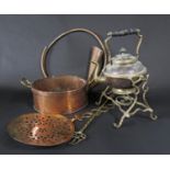 A 19th century copper double handled saucepan, a circular copper hunting horn and a brass skimmer