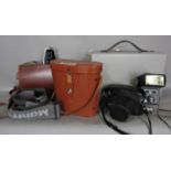 Photographic equipment including a Pentax SP500, a Bolex cine camera, a pair of binoculars and a