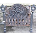 A small cast iron fire basket of rectangular form and combined oval back, relief detail, pierced and