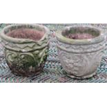 A pair of weathered cast composition stone garden planters of circular tapered form with repeating