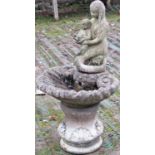 A weathered cast composition stone three sectional garden fountain, the possibly associated figure