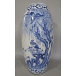 A large 19th century oriental blue and white vase with painted decoration of birds in trees, 60cm
