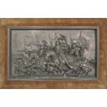 A bronzed effect relief wall plaque of charging mounted knights within a velvet lined frame, 63 cm x