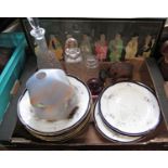 A large miscellaneous collection of items, a top hat, a bowler hat, plates and bowls, decanters,