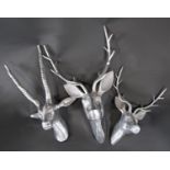 An aluminium trophy of a stags head, another of a small deer and one of an antelope (3)