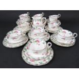 A collection of early 20th century Aynsley teawares with rose detail, comprising milk jug, slop or