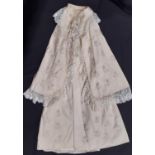 Early 20th century baby garments including a carry shawl with embroidered wool cape lined in silk