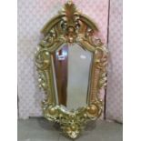 A small shield shaped pier glass, with carved gilt scrolling acanthus moulded frame, 78cm x 40cm