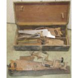 A vintage wooden portable carpenters tool chest and contents including a selection of various hand