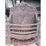 A small Georgian style cast iron fire grate and combined back with bow fronted basket, urn finials