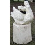 A novelty cast composition stone garden planter in the form of a swan, with painted finish, sat on