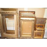 A collection of gilt picture frames with moulded and other detail, various sizes (22)