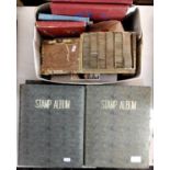 Four stamp albums dating from the 1950s onwards containing British and worldwide stamps including