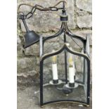 A contemporary Regency gothic style hall lantern of square form with glazed arched panels, enclosing