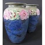 A pair of Royal Doulton vases with blue mottled glaze and moulded and painted repeating floral