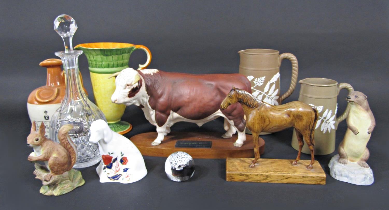 A Beswick Connoisseur model of a Hereford bull raised on an oval wooden base, together with an