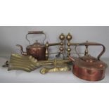 A collection of brass and copperware including fire tools, copper kettles, etc