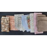 A box of fabric remnants including floral prints together with a vintage single curtain in '