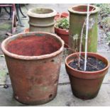 A weathered terracotta planter of circular tapered form 50 cm in diameter x 45 cm high (AF),