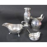 A mixed collection of 19th century silver; a sauce boat, milk jug, sugar sifter and wine ladle, 15