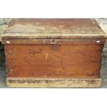 A 19th century stained pine box with hinged lid lined with penny red stamps and enclosing a hinged