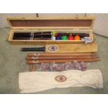 A boxed traditional garden game croquet set together with a promotional Foster Brewing Company Ltd