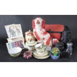 A Staffordshire style King Charles spaniel, a 'hang dog' biscuit barrel, two paperweights, teapot,