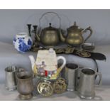 A mixed lot of four pewter tankards, horse brasses, cottage teapot, brass teapots, etc