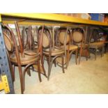 15 bentwood cafe chairs with circular cane panelled seats and backs together with two wicker