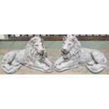 A pair of cast composition stone garden ornaments in the form of recumbent lions with flowing manes,