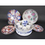 An oriental warming dish and cover with blue and white painted landscape and character decoration,