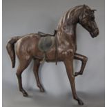 A leather model of a prancing horse, 49 cm x 50 cm approximately