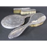 An early 20th century mixed ladies silver dressing table brush and mirror set (4)