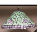 A Tiffany style coloured leaded light domed ceiling light/shade with foliate detail in purple and